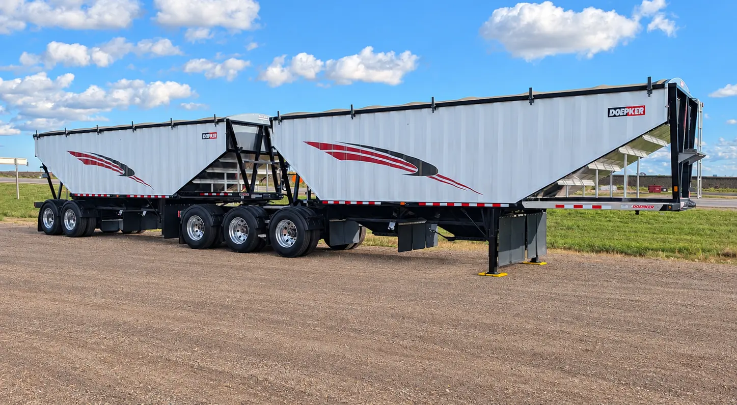 Doepker Super B grain trailers on a gravel lot