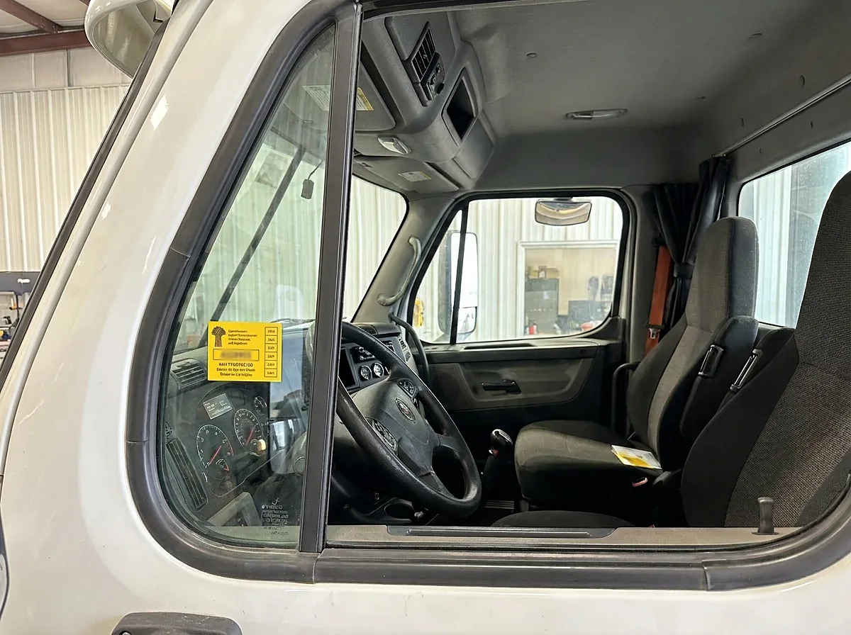 SGI commercial vehicle safety inspection sticker on a truck cab window